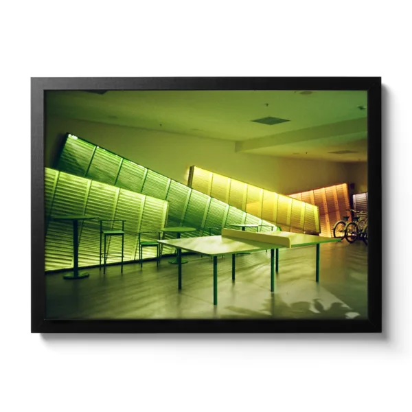 Image of a table tennis table illuminated with green neon lights