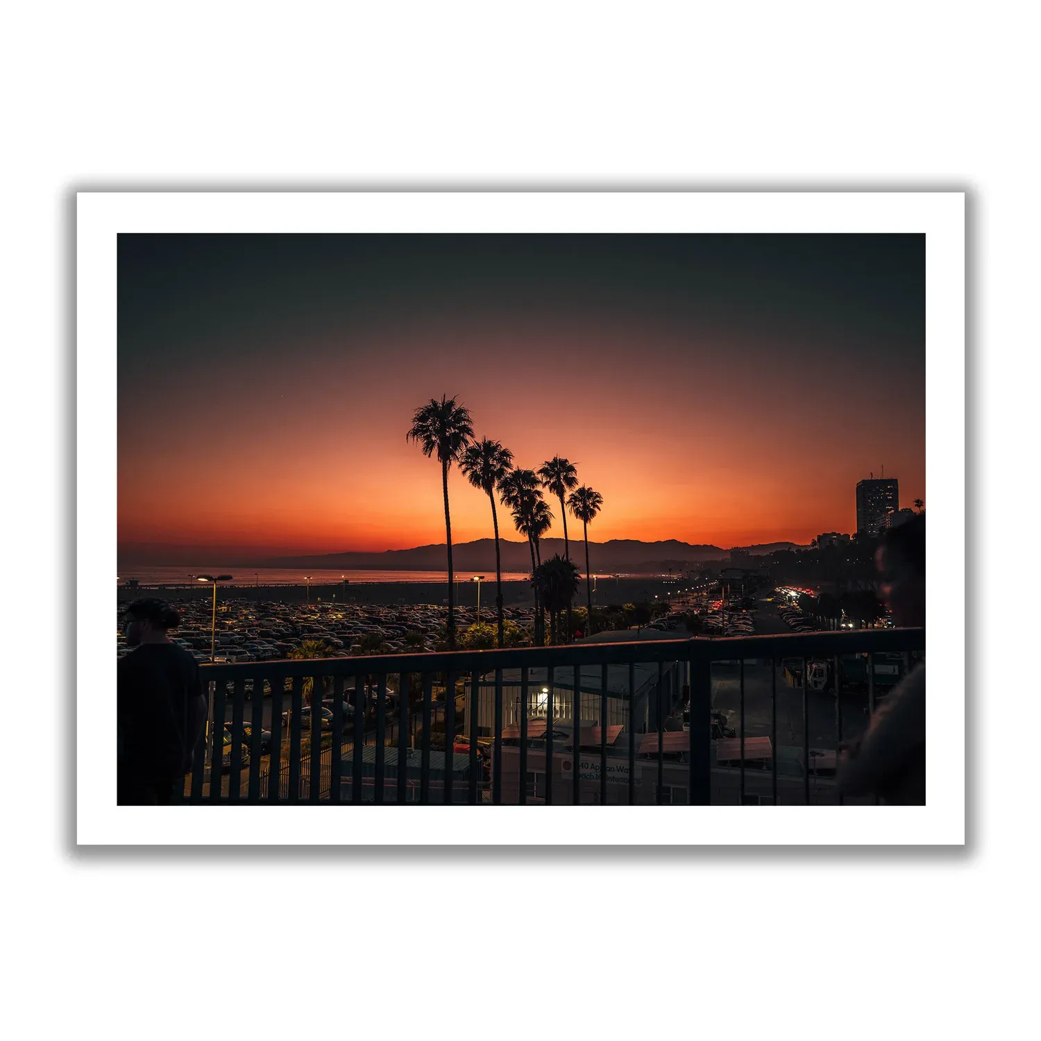 Sunset Pier Yellow-red sunset with palm trees in Santa Monica