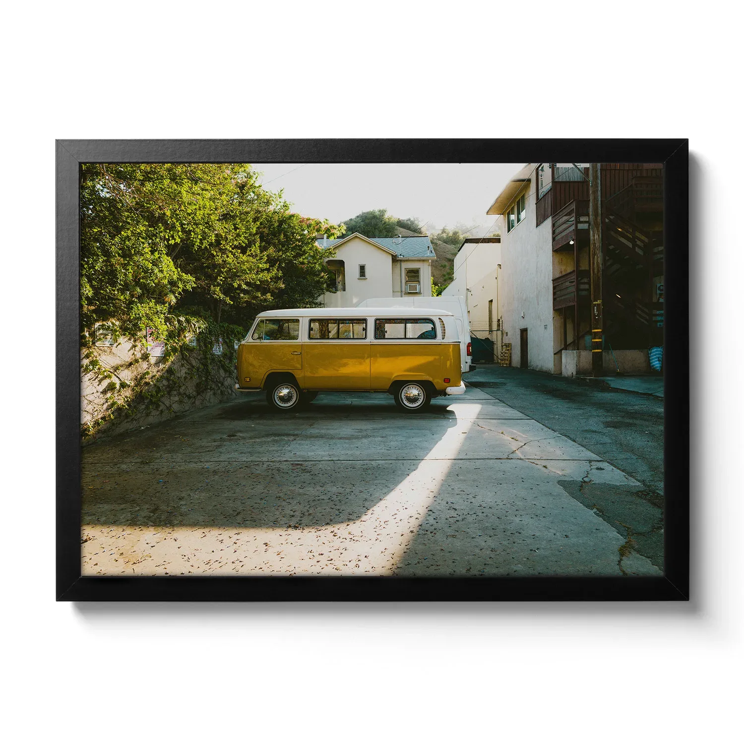 Old yellow VW Buli parked in a side street, with a cool incidence of light (vintage look)