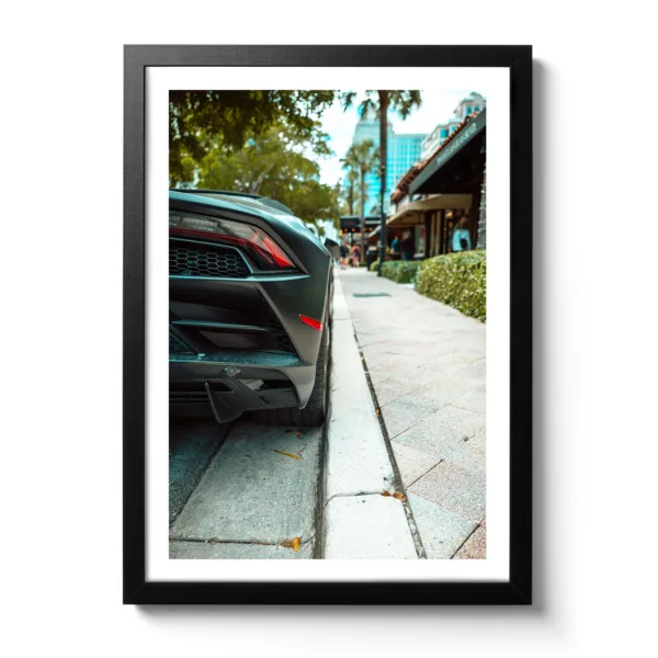Picture of a black Lamborghini Gallardo parking.