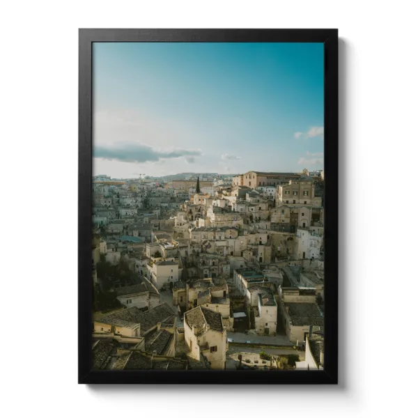 Skyline view of Matera (Italy) in portrait format. Blue sky and light sunset mood