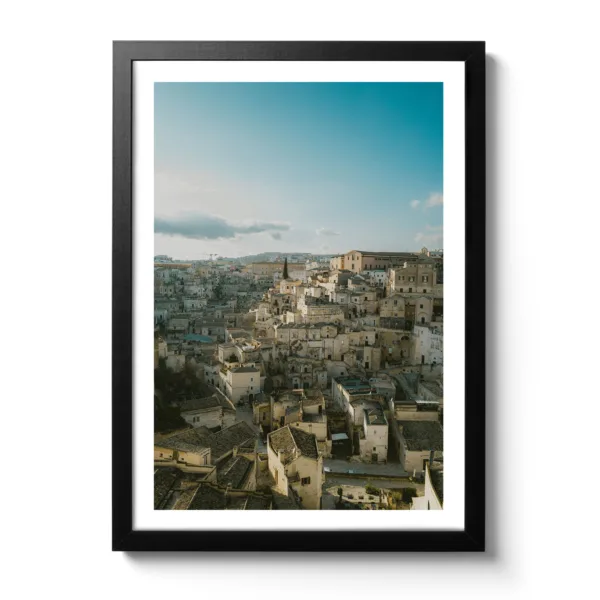 Skyline view of Matera (Italy) in portrait format. Blue sky and light sunset mood